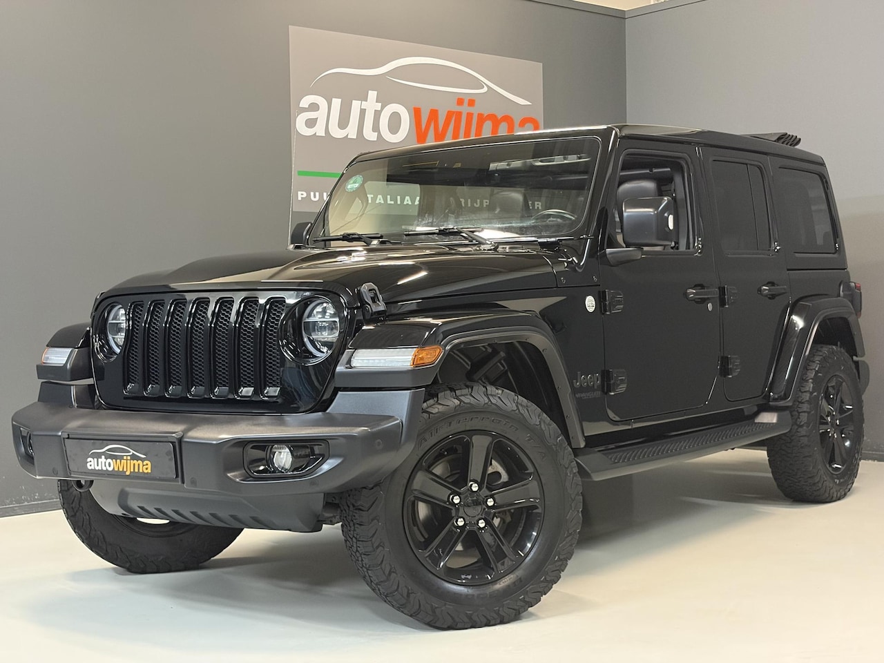 Jeep Wrangler Unlimited - 2.0T Sahara Elektrisch softtop (Sky-one touch power top), Full options! - AutoWereld.nl