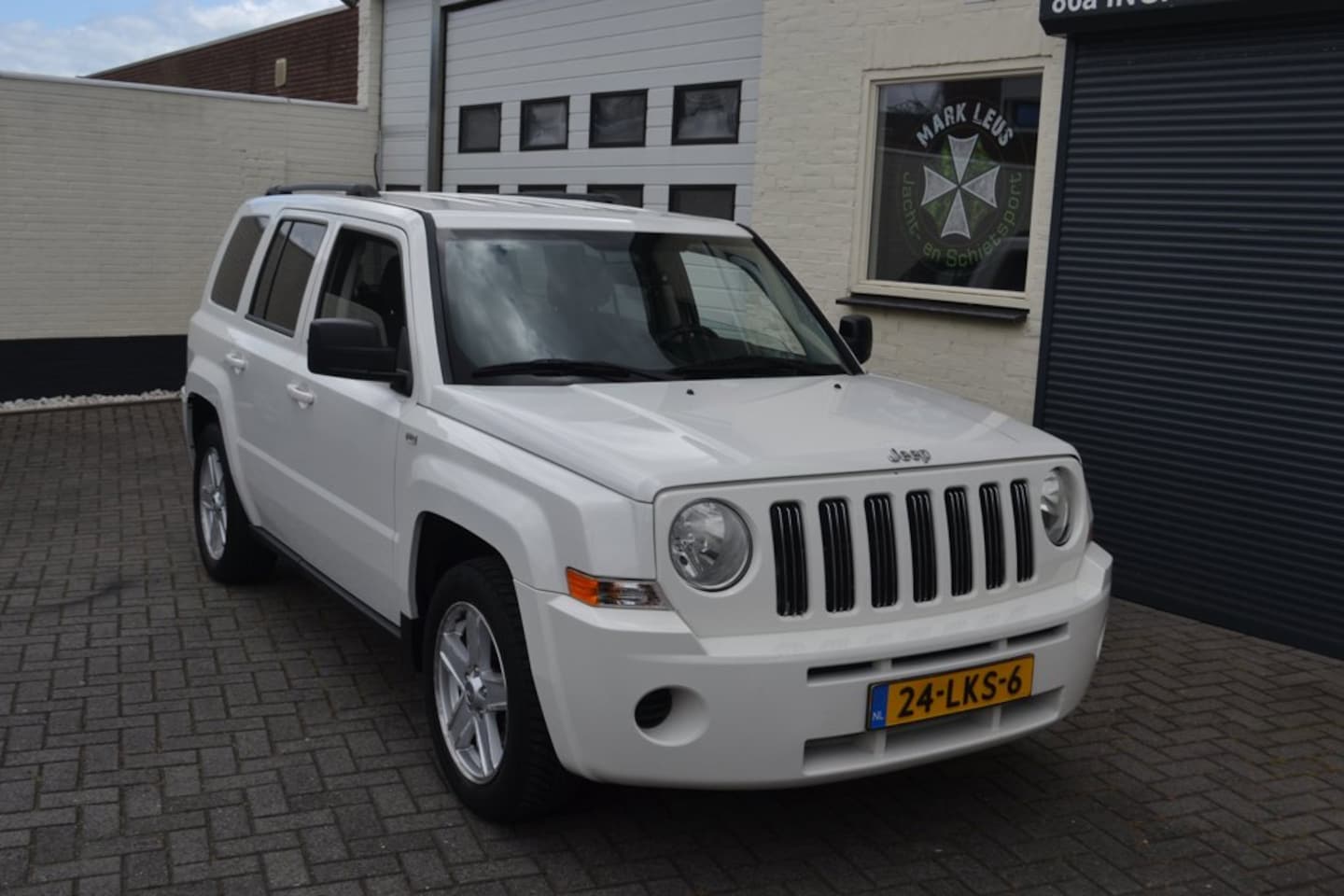 Jeep Patriot - 2.4 Sport Liberty 4x4 cruise - AutoWereld.nl