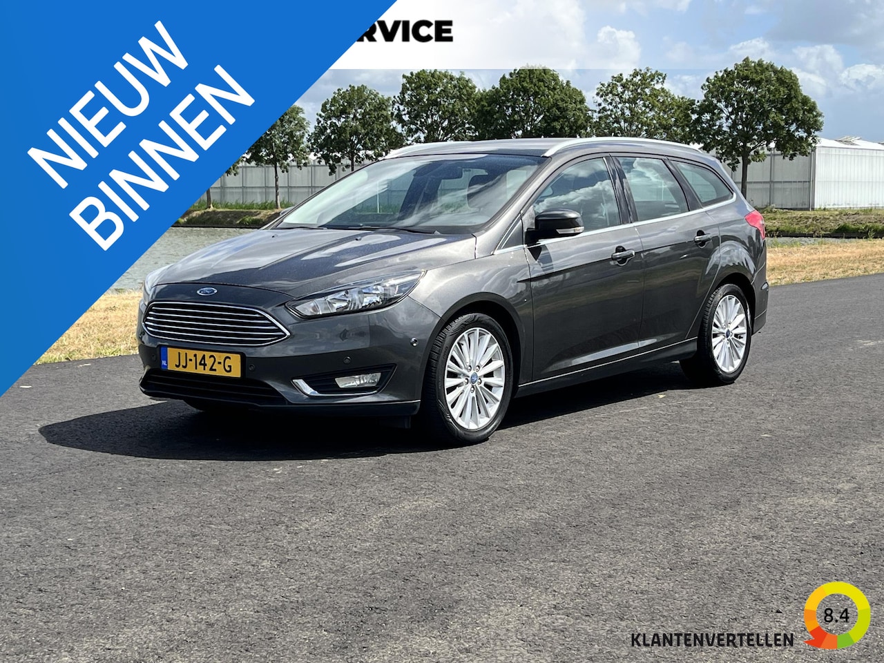 Ford Focus Wagon - 1.0 Titanium Clima, cruise, pdc, trekhaak - AutoWereld.nl