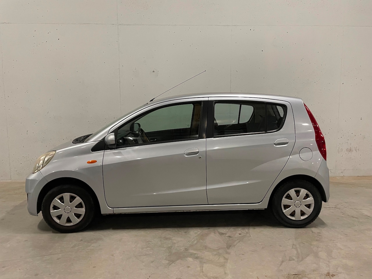 Daihatsu Cuore - 1.0 Premium 5drs. Airco Trekhaak - AutoWereld.nl