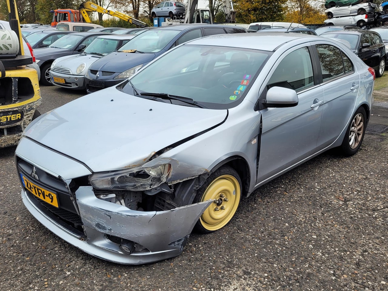 Mitsubishi Lancer - 1.6 Edition One | In Prijs Verlaagd! | Schade! | Leder | Clima | Trekhaak! - AutoWereld.nl