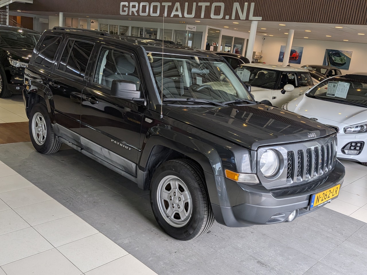 Jeep Patriot - 2.4 Sport Liberty Airco, Cruise Control, Stuurbekrachtiging - AutoWereld.nl