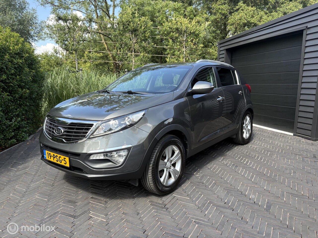Kia Sportage - 2.0 X-ecutive Plus Pack|Trekhaak|Airco| - AutoWereld.nl