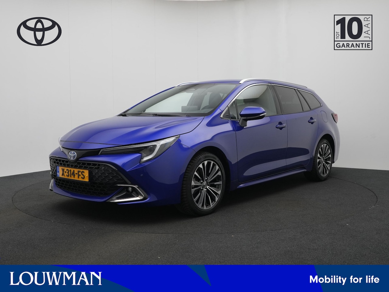 Toyota Corolla Touring Sports - 1.8 Hybrid First Edition | Elek. Kofferklep | Parkeersensoren | Half lederen bekleding | - AutoWereld.nl