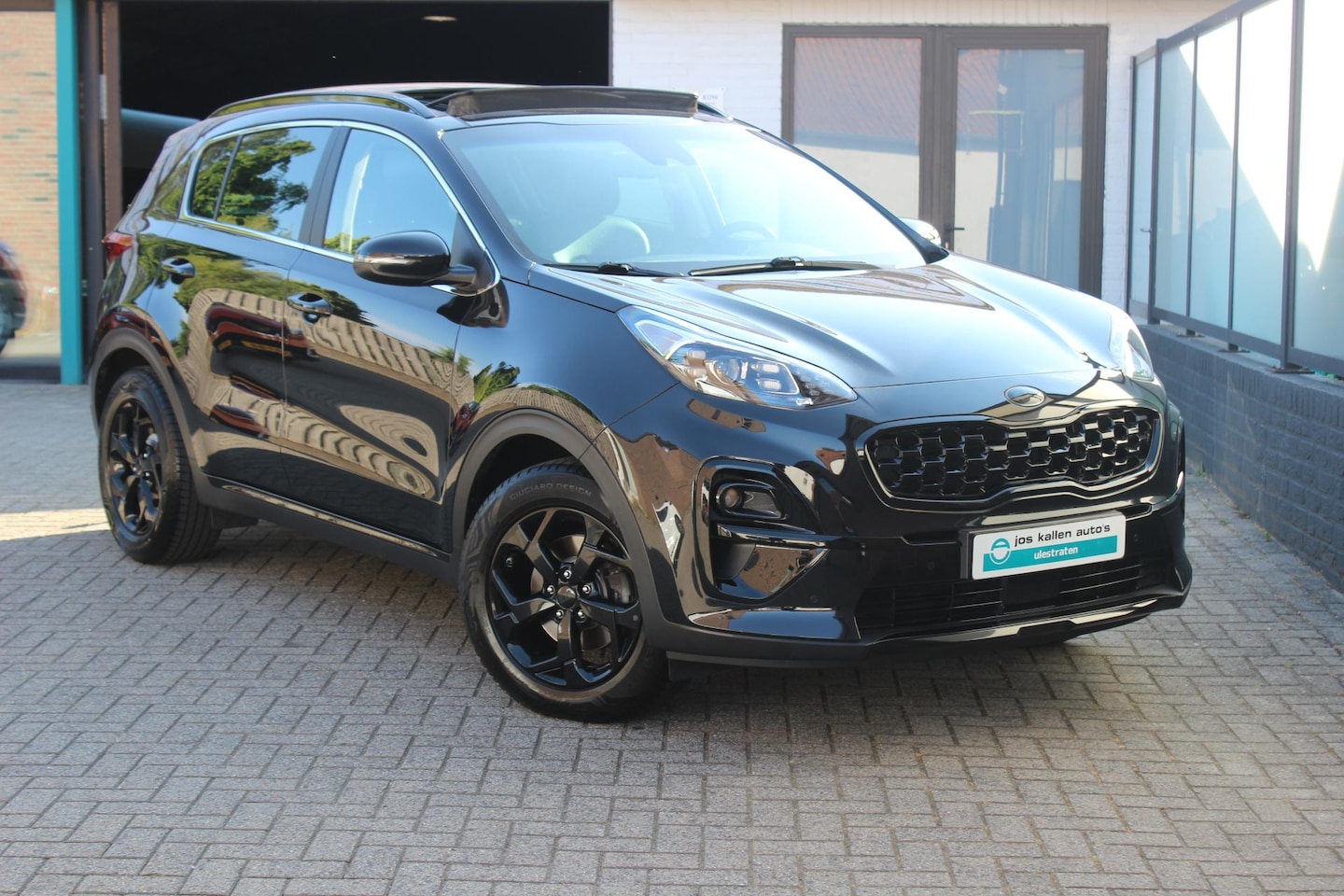 Kia Sportage - 1.6 T-GDI Black Edition Full Option|All Season|Trekhaak|Panoramadak|Camera - AutoWereld.nl