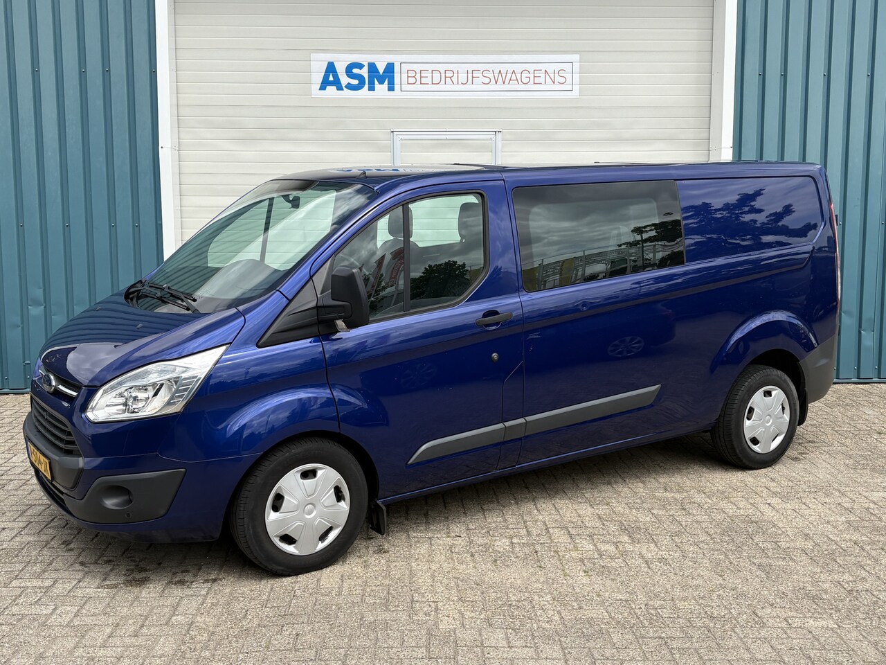 Ford Transit Custom - 310 2.0 131Pk TDCI L2H1 Trend DC / Cruise / Airco / Trekhaak - AutoWereld.nl