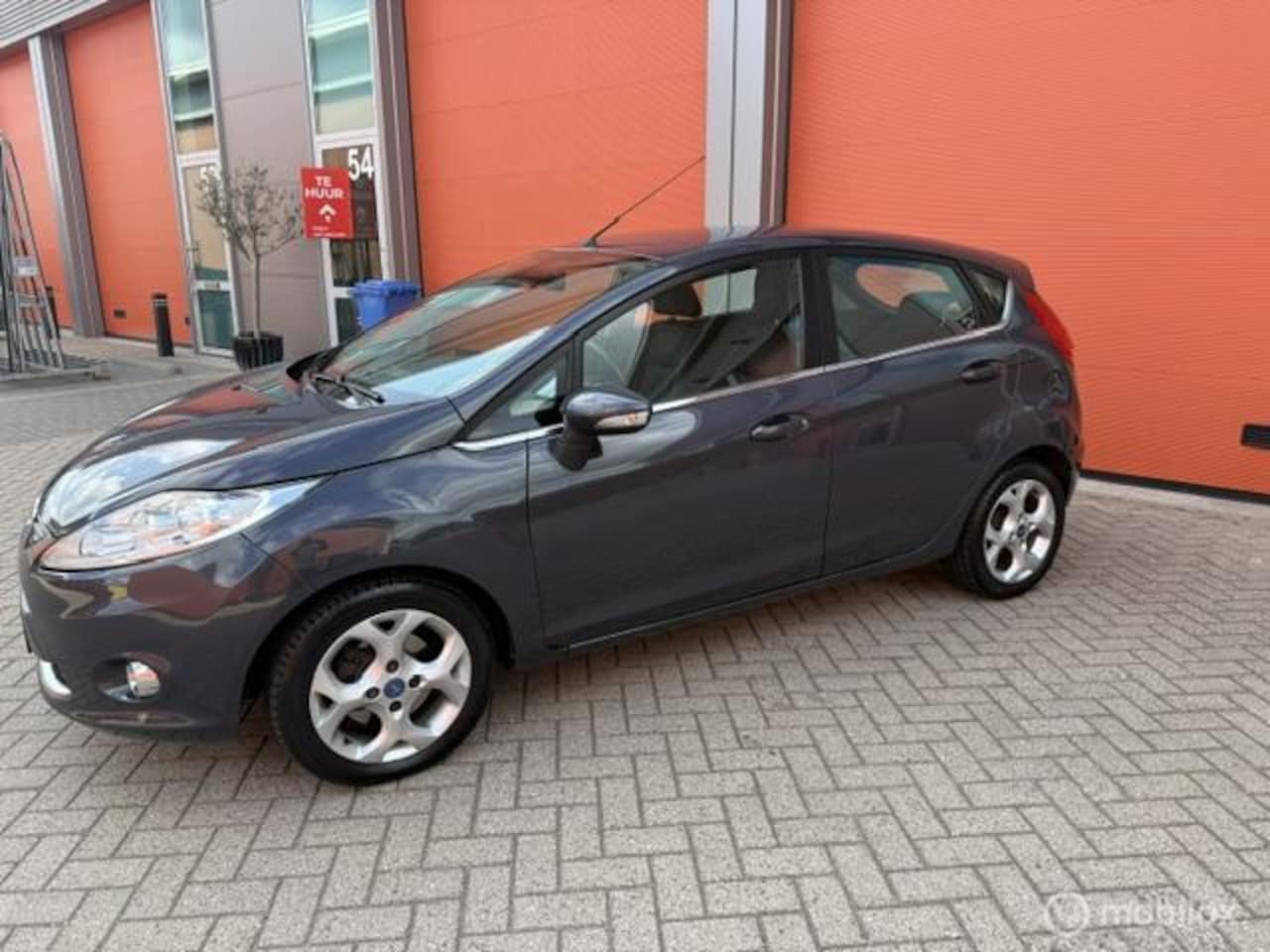Ford Fiesta - 1.25 Titanium 5 DRS -KM NAP-AIRCO-LM -APK - AutoWereld.nl