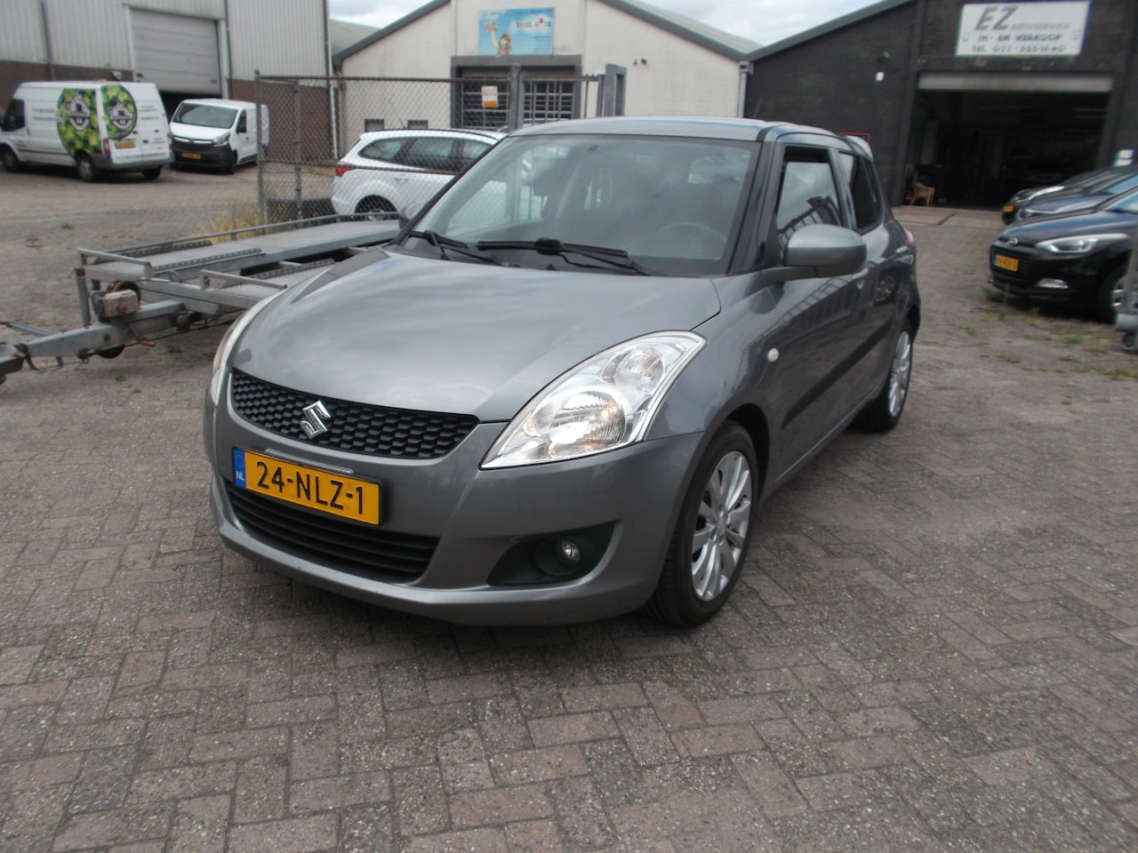 Suzuki Swift - 1.2 Exclusive EASSS eerste eigen. airco - AutoWereld.nl