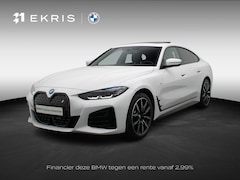 BMW i4 - eDrive40 M Sportpakket Pro | Stuurwielrand Verwarmd | Achteruitrijcamera | Schuifdak | DAB