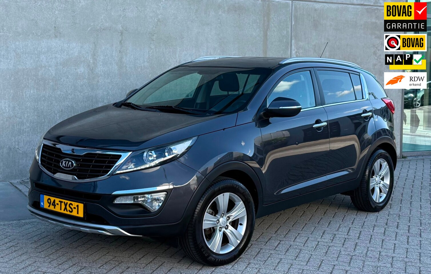 Kia Sportage - 1.6 GDI X-ecutive Plus Pack Grijs 2012 NAP|APK - AutoWereld.nl