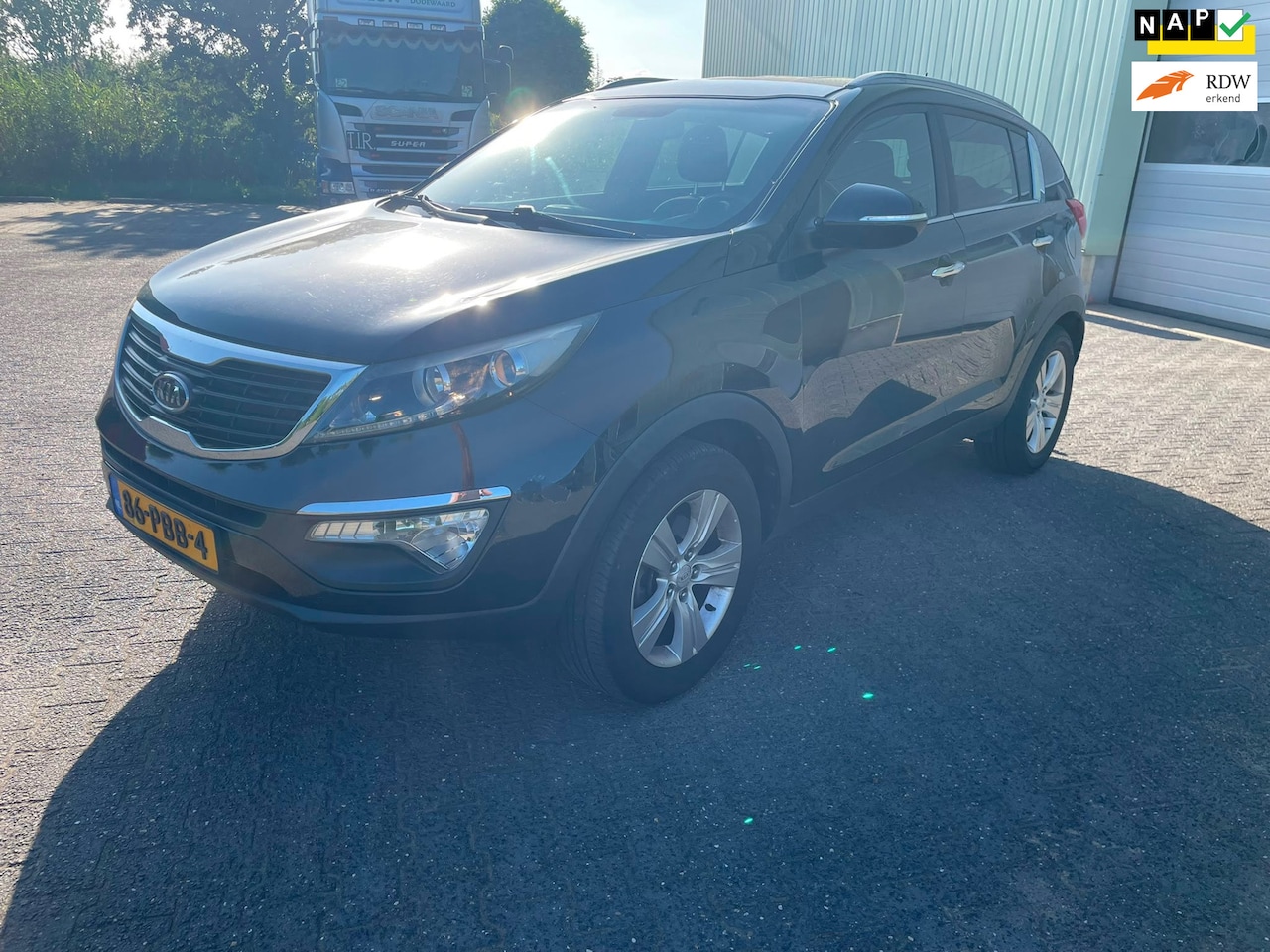 Kia Sportage - 2.0 X-ecutive Plus Pack Airco/Trekhaak/Cruise control/Donker glas - AutoWereld.nl