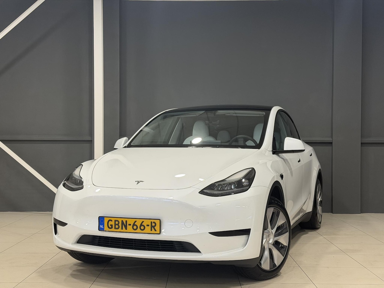 Tesla Model Y - RWD 58 kWh | Trekhaak | SOH | Wit leder interieur | - AutoWereld.nl