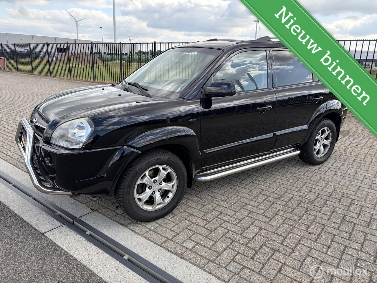 Hyundai Tucson - 2.0i Style Cross 2.0i Style Cross - AutoWereld.nl