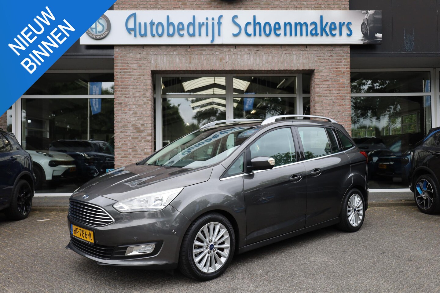 Ford Grand C-Max - 1.0 Titanium NAVI CLIMA LMV 17" TREKHAAK VOORRUITVERWARMING PANO PARKEERSENSOREN CRUISE NA - AutoWereld.nl
