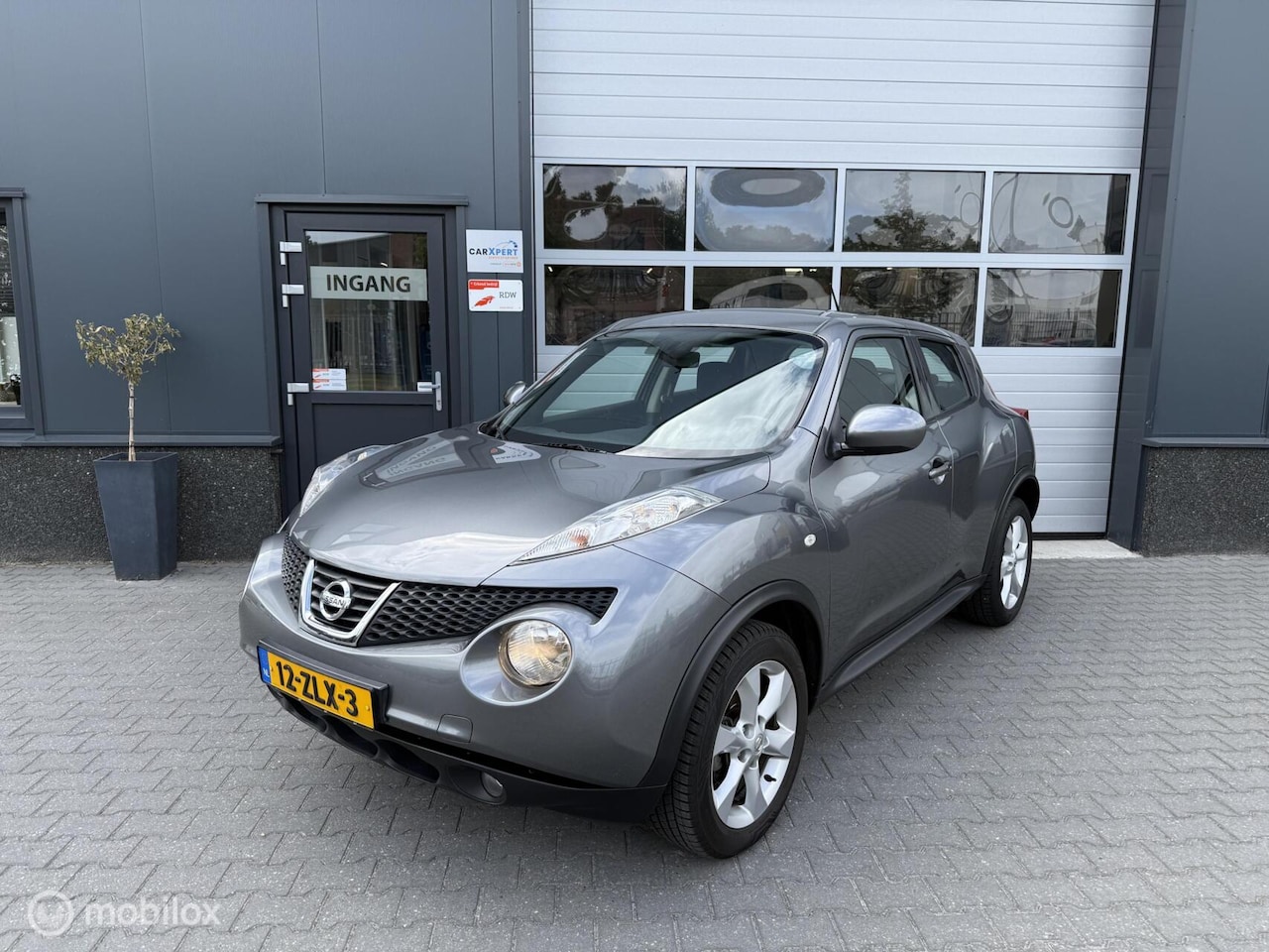 Nissan Juke - 1.6 Acenta / Automaat / Airco / Cruise! - AutoWereld.nl