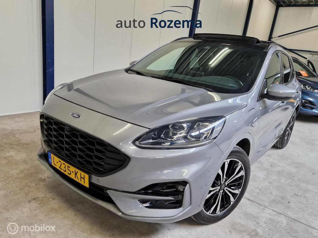 Ford Kuga - 2.5 PHEV ST-Line X Ecc Navi Leder-Alcan Elec-Haak 360 Camera Dak 100% 63 km - AutoWereld.nl