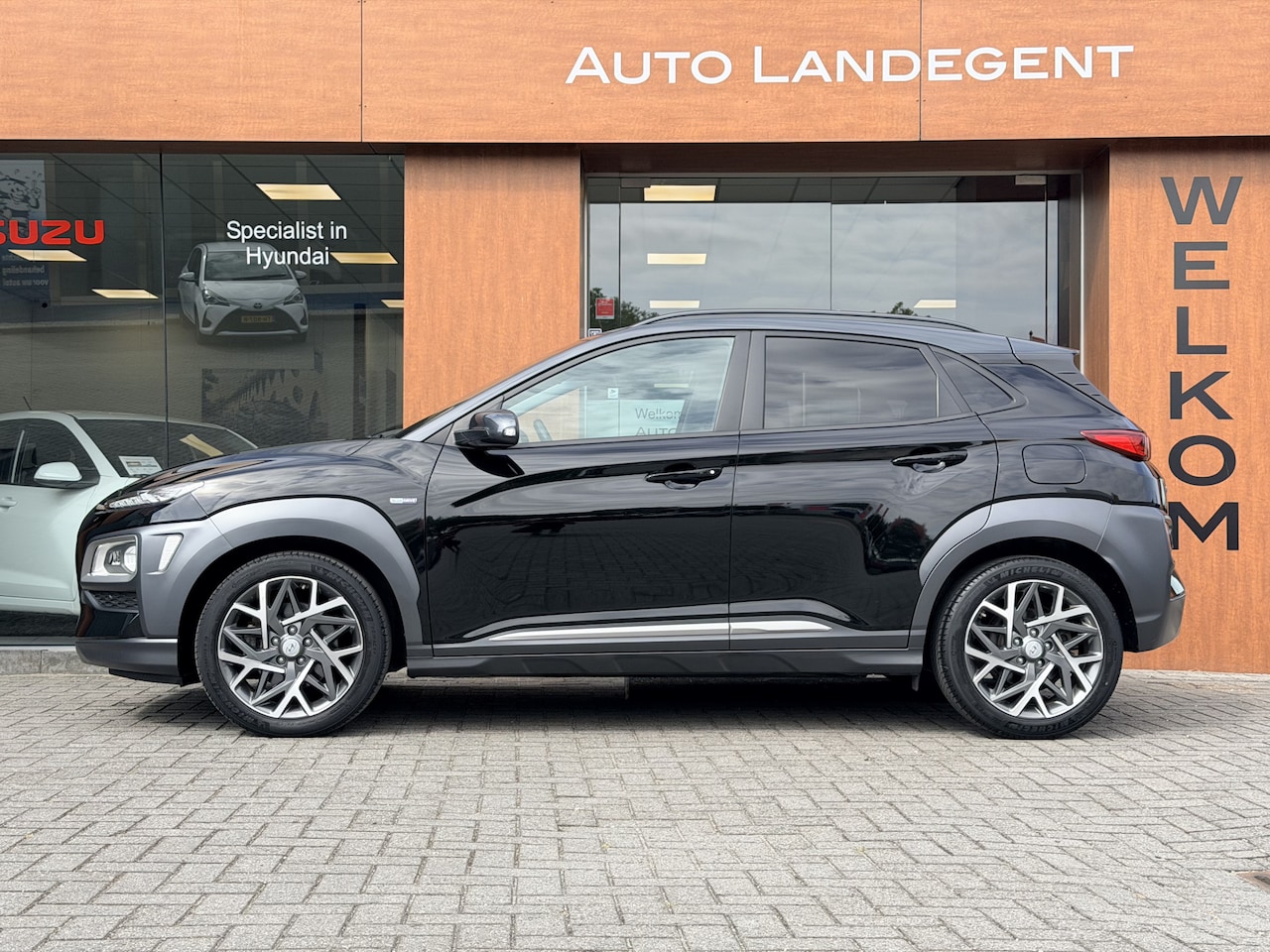 Hyundai Kona - 1.6 GDI HEV Premium Two-Tone | Carplay | Camera | Cruise control | DAB | NAV - AutoWereld.nl