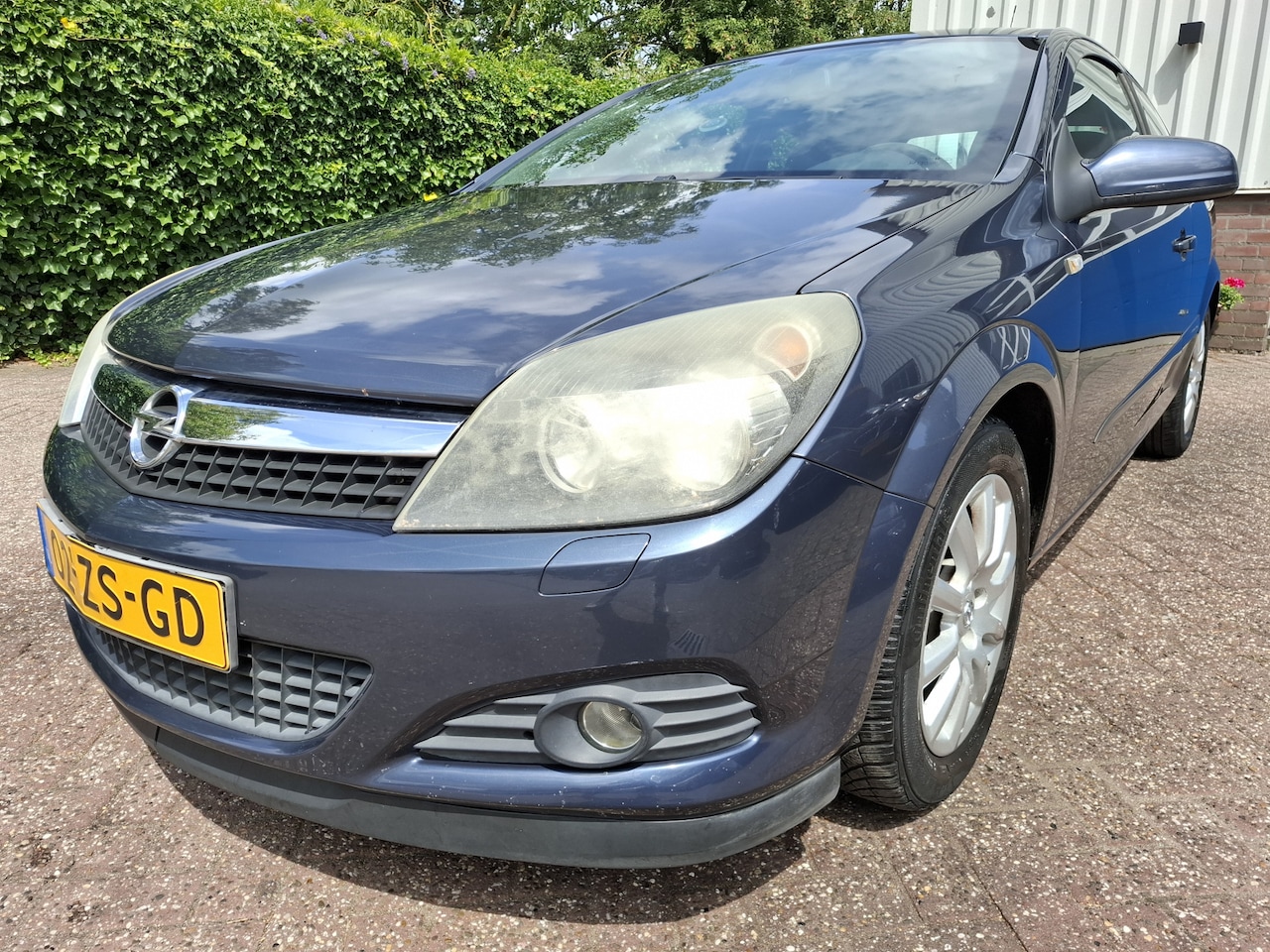 Opel Astra GTC - 1.6 AIRCO/CRUISE/NAVI/PDC.A/TREKHAAK 116PK - AutoWereld.nl