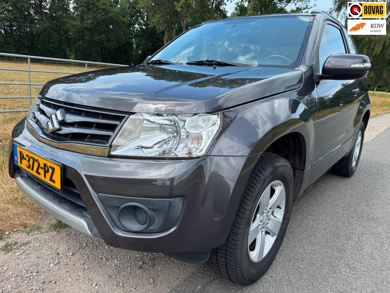 Suzuki Grand Vitara - 1.6 Exclusive dealer onderhouden|climate control|trekhaak - AutoWereld.nl