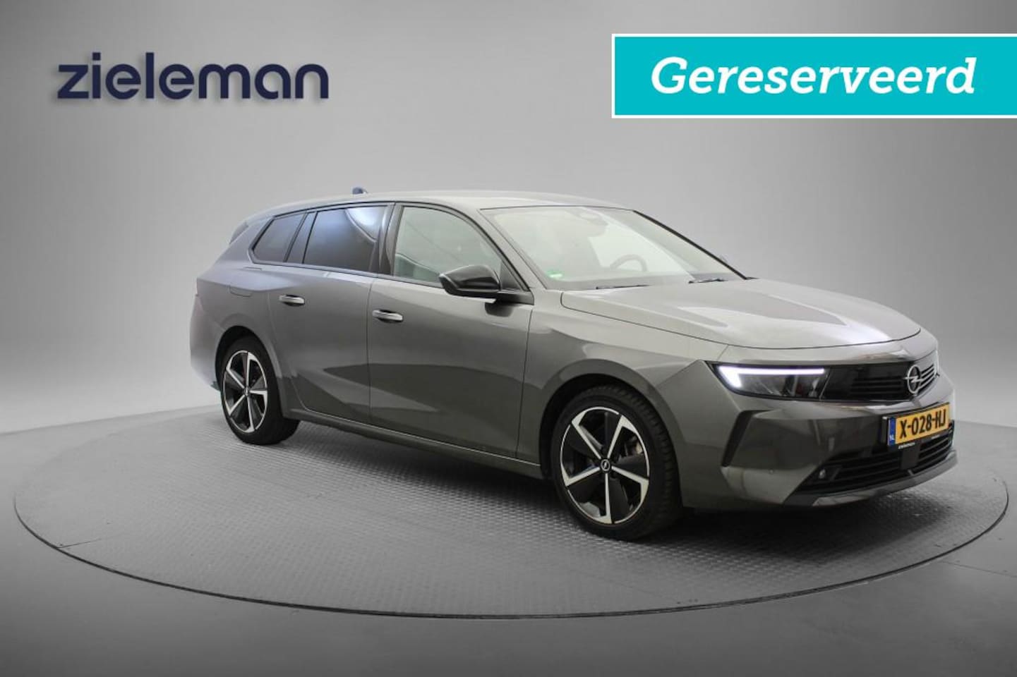 Opel Astra Sports Tourer - 1.6 PHEV Hybrid Business - Carplay, Camera, Stuur/Stoelverw.GERESEVEERD!!! - AutoWereld.nl