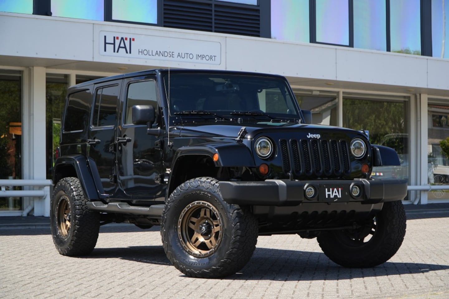 Jeep Wrangler Unlimited - 3.6 V6 Automaat Sahara I Hardtop I Verhoogd - AutoWereld.nl