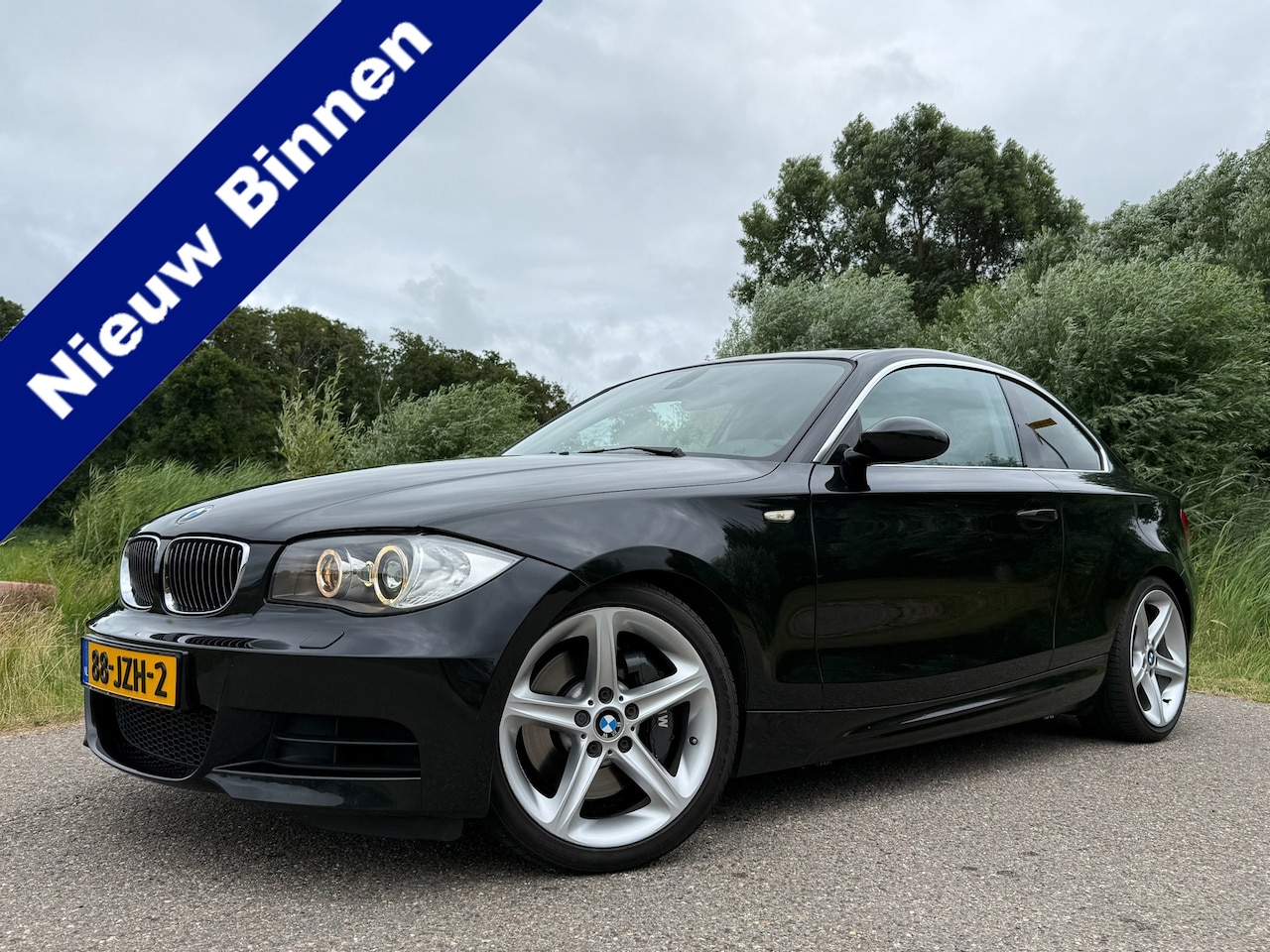 BMW 1-serie Coupé - 135i High Executive | Origineel NL | Handgeschakeld | 18" Velgen | Stoelverwarming | Clima - AutoWereld.nl