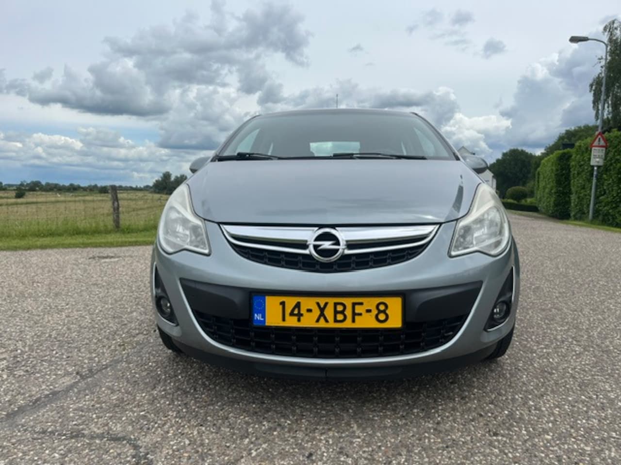 Opel Corsa - 1.4-16V Color Edition Airco navi 153976 km nap bj 2012 5 drs - AutoWereld.nl