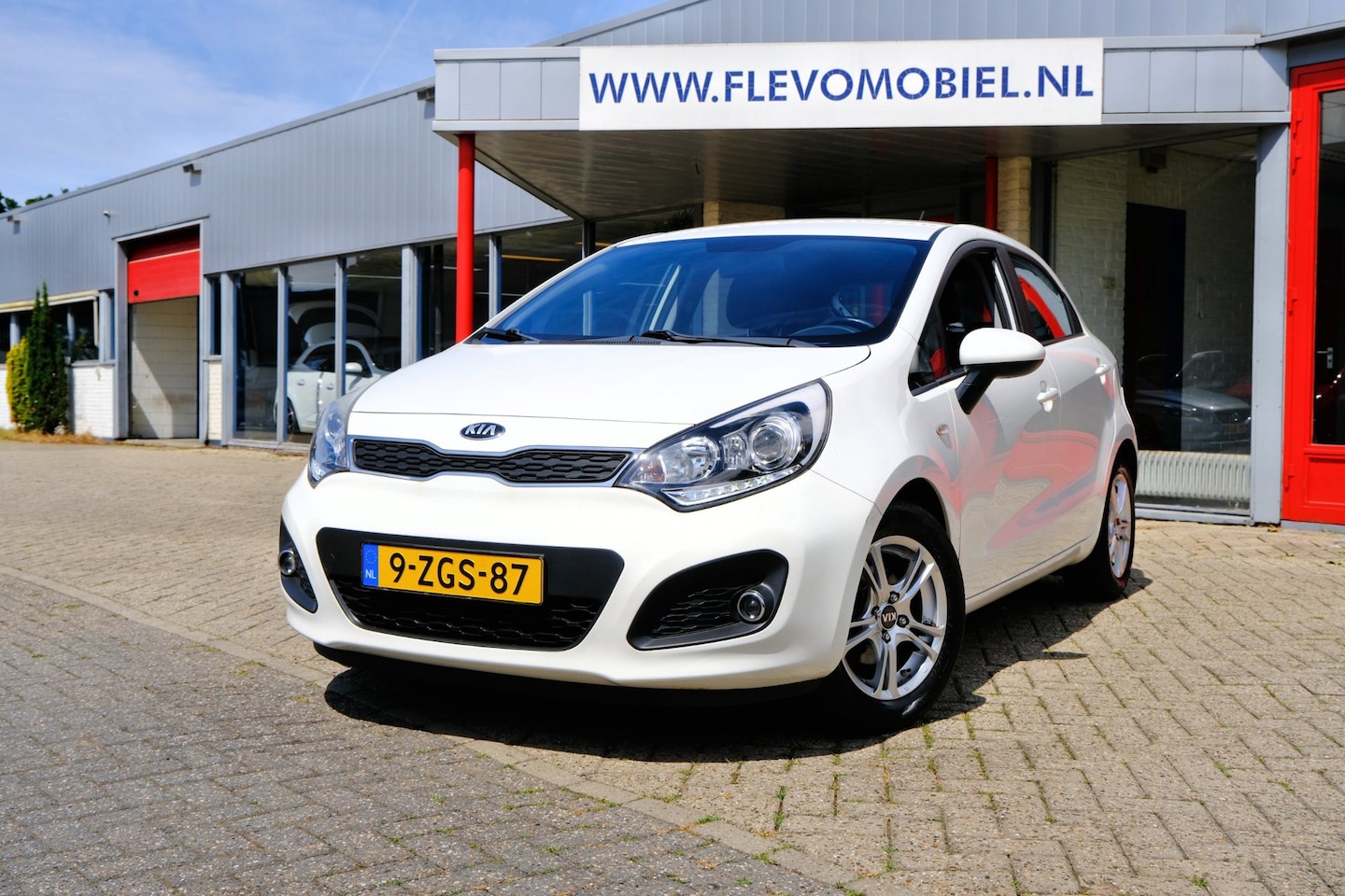 Kia Rio - 1.2 CVVT BusinessLine 5-drs *65.150km!* Airco|1e Eig|Cruise|LMV - AutoWereld.nl