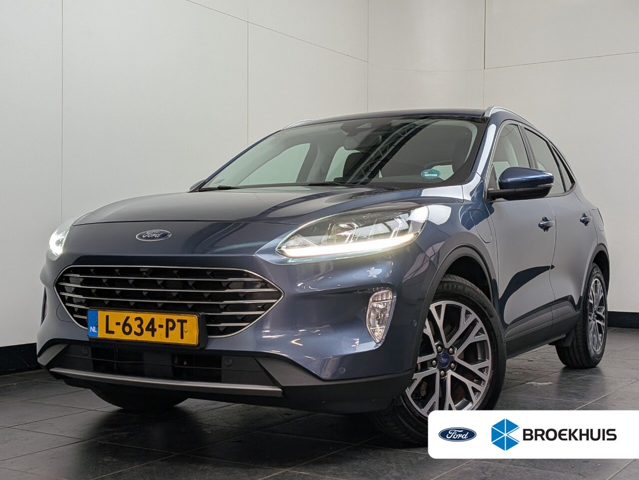 Ford Kuga - 2.5 PHEV Titanium | 1e Eigenaar! | Winterpack | Cruise Adaptive | 360 Camera | Clima | Nav - AutoWereld.nl
