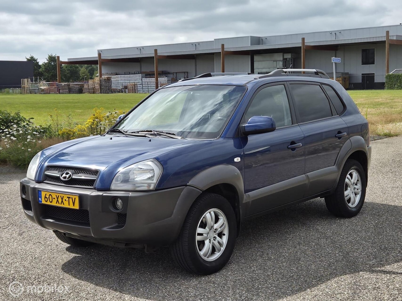 Hyundai Tucson - 2.0i Dynamic Cross Cruise / Airco / Trekhaak - AutoWereld.nl