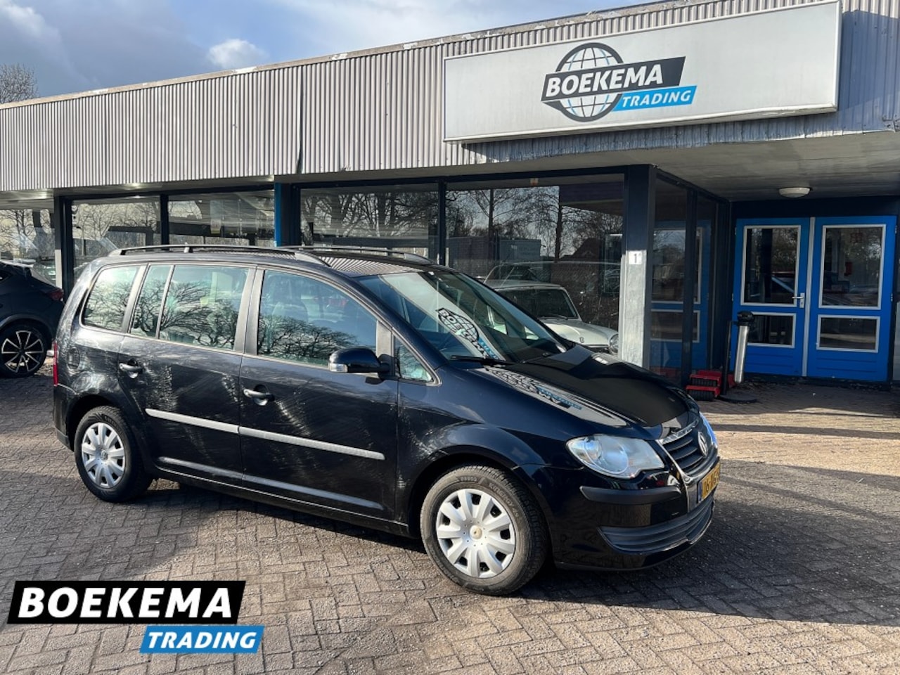 Volkswagen Touran - 1.4 TSI 140PK Business Navigatie Cruise Climate - AutoWereld.nl