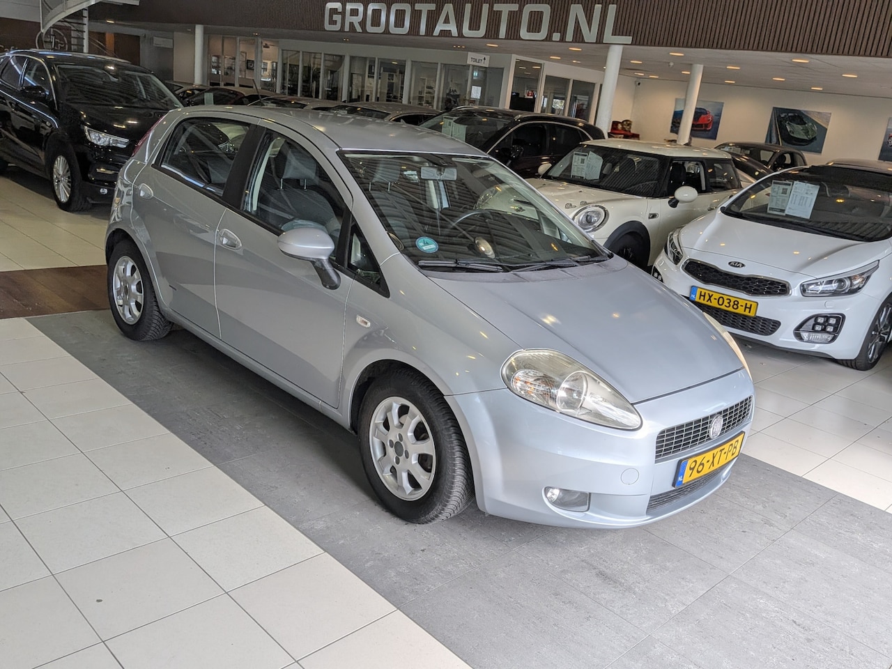 Fiat Grande Punto - 1.4 Dynamic NAP, Trekhaak, Cruise Control, Airco - AutoWereld.nl