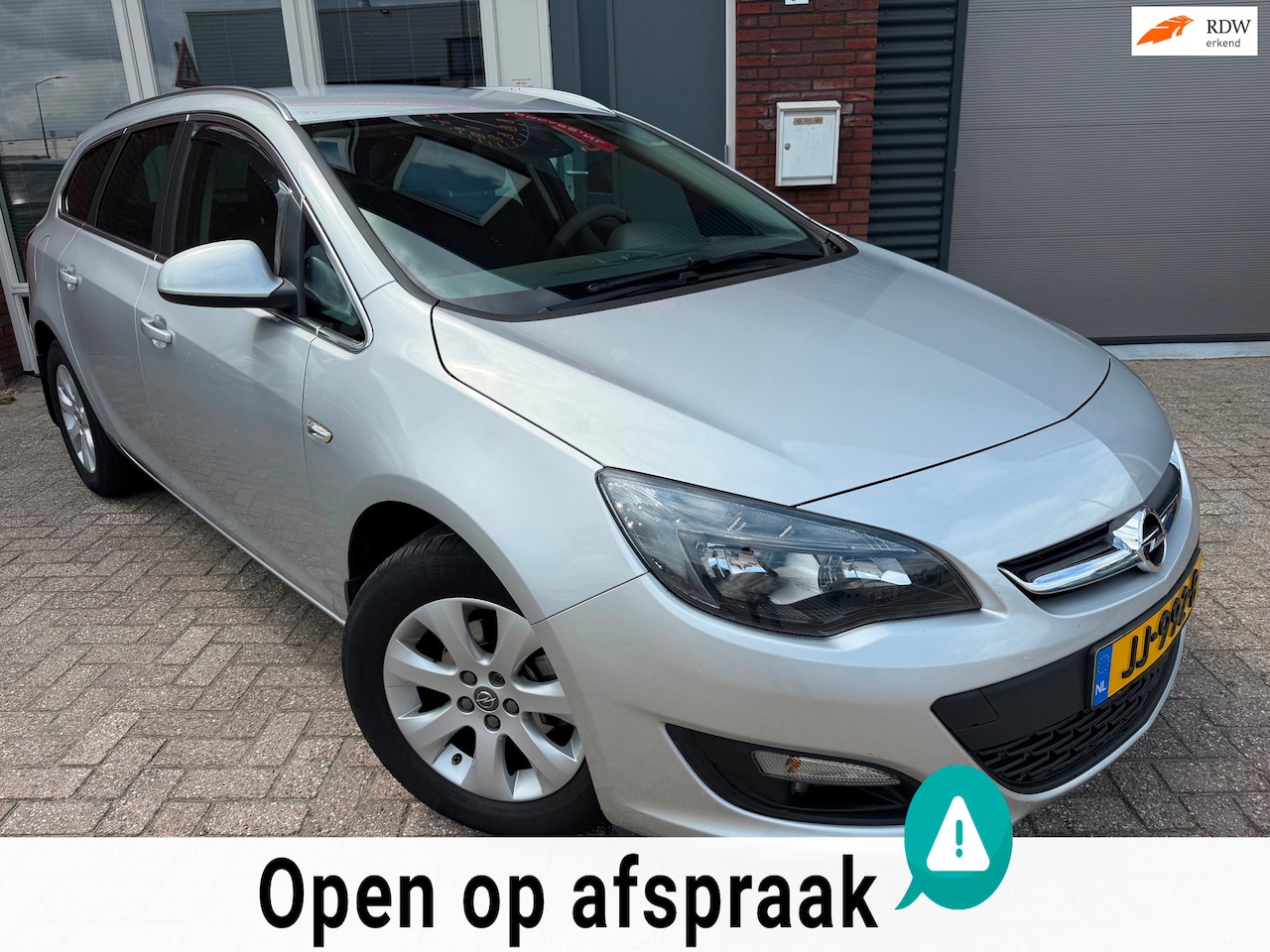 Opel Astra Sports Tourer - 1.4 Turbo Blitz / Navi / PDC / Airco / Cruise / NAP / Unieke km - AutoWereld.nl