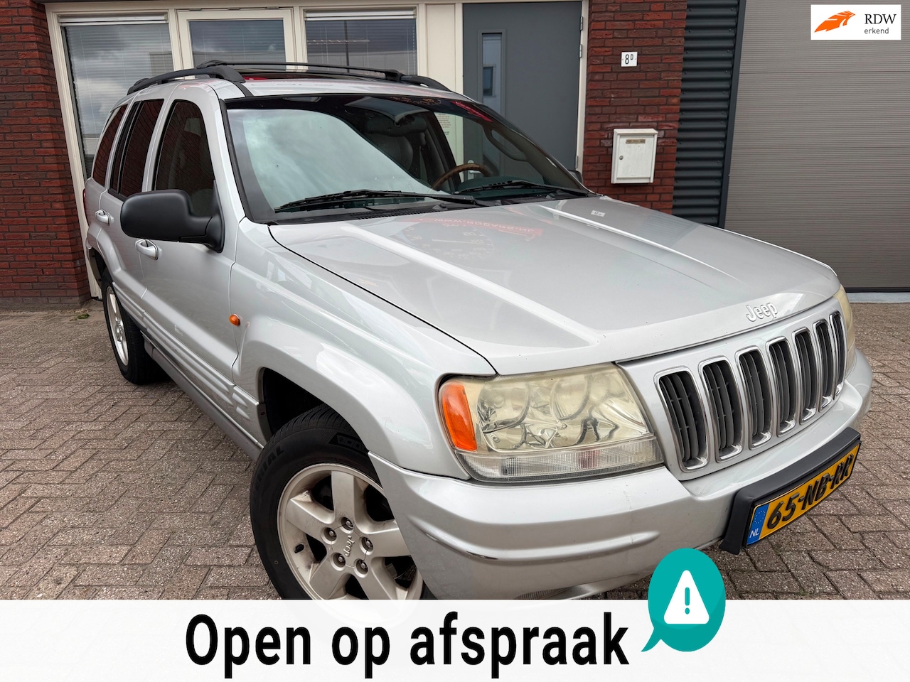 Jeep Grand Cherokee - 4.7i V8 Overland High Output / Pano / Leder / PDC / Memory - AutoWereld.nl