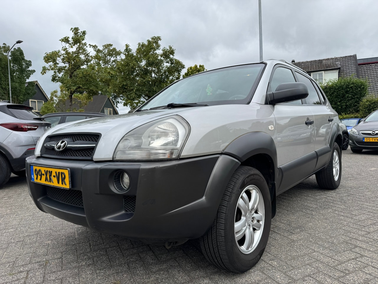 Hyundai Tucson - 2.0i Dynamic 2.0i Dynamic 141pk,Apk 25/4/27,Airco,Cruise,Trekhaak - AutoWereld.nl