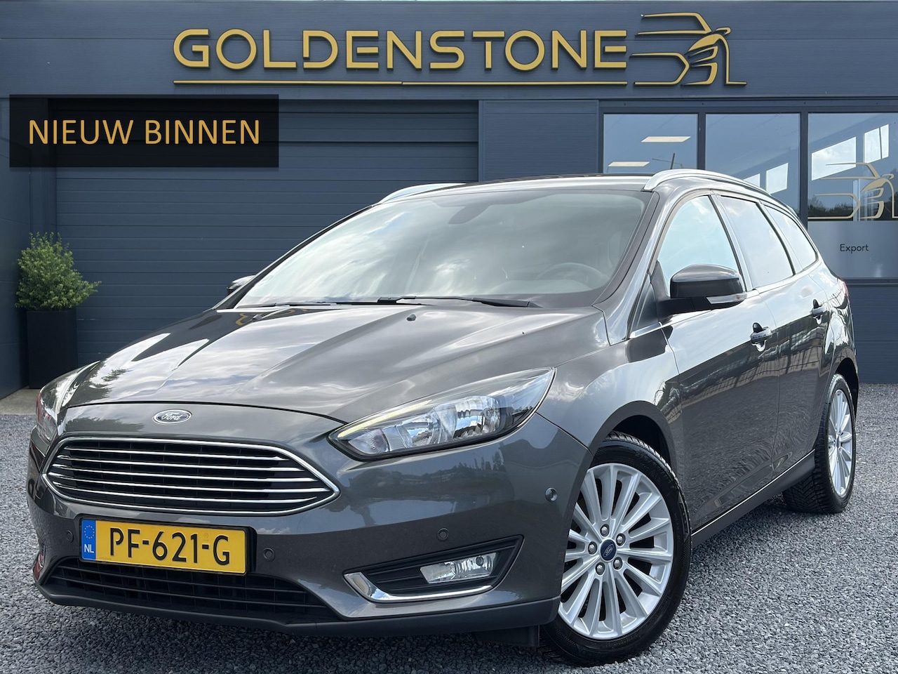 Ford Focus Wagon - 1.0 Titanium 2e Eigenaar,Navi,Trekhaak,125pk,Clima,Cruise,Pdc V+A,6 Bak,Lm velgen,N.A.P,Ap - AutoWereld.nl