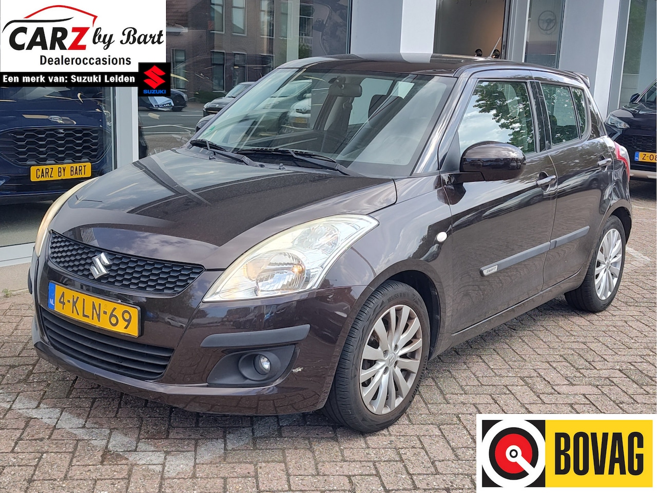 Suzuki Swift - 1.2 BANDIT EASSS Sportpakket | Cruise | Airco | Trekhaak - AutoWereld.nl