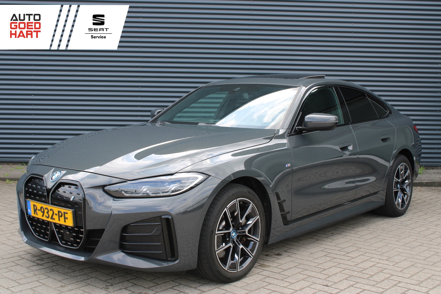 BMW i4 - eDrive40 84 kWh M-Sport Dravitgrau Schuif-/kanteldak Leer Harman-Kardon Camera - AutoWereld.nl