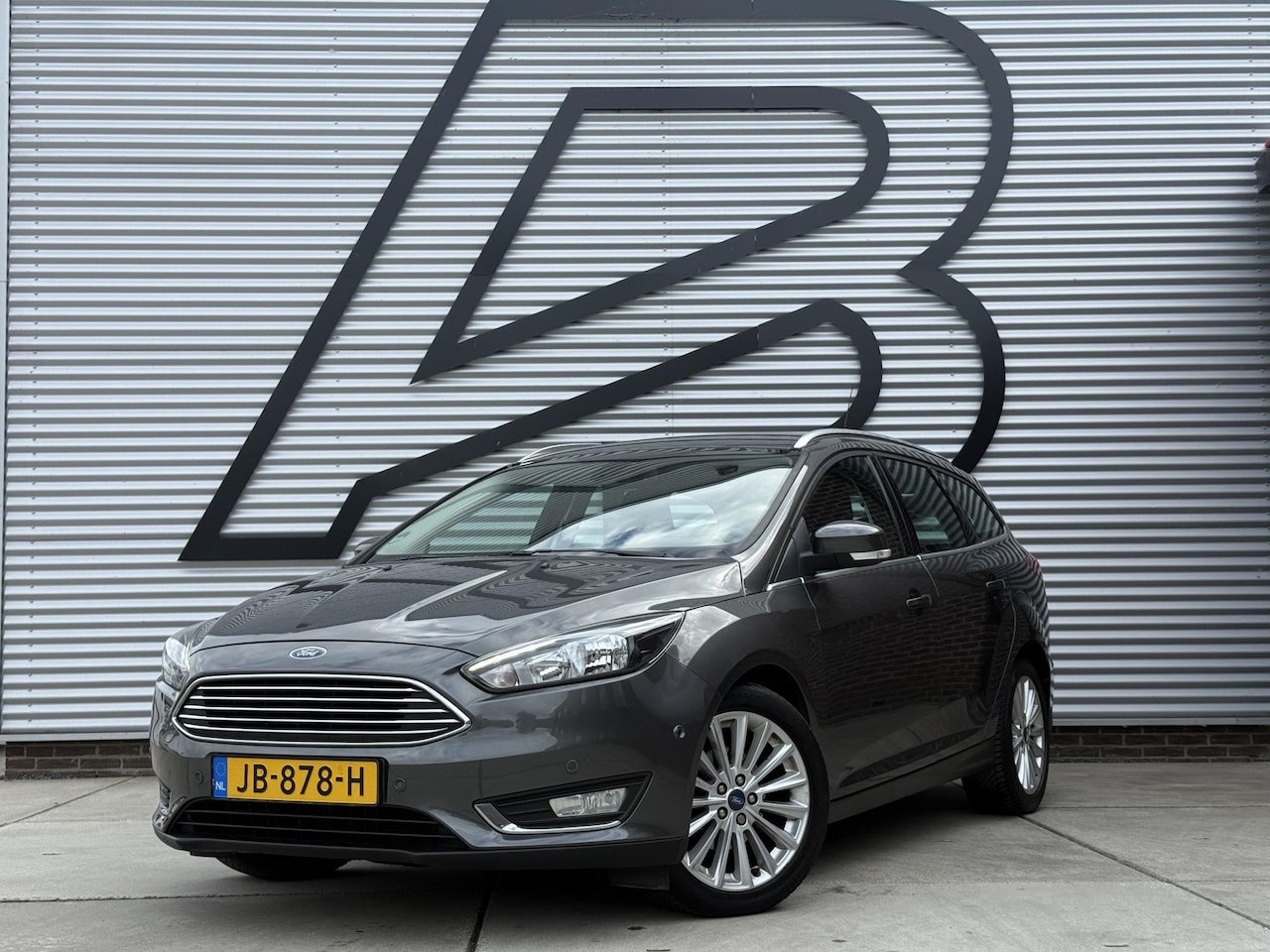 Ford Focus Wagon - 1.0 Titanium 2e Eigenaar|Clima|Cruise|PDC V+A|Navi|N.A.P|APK tot 01-2027 - AutoWereld.nl