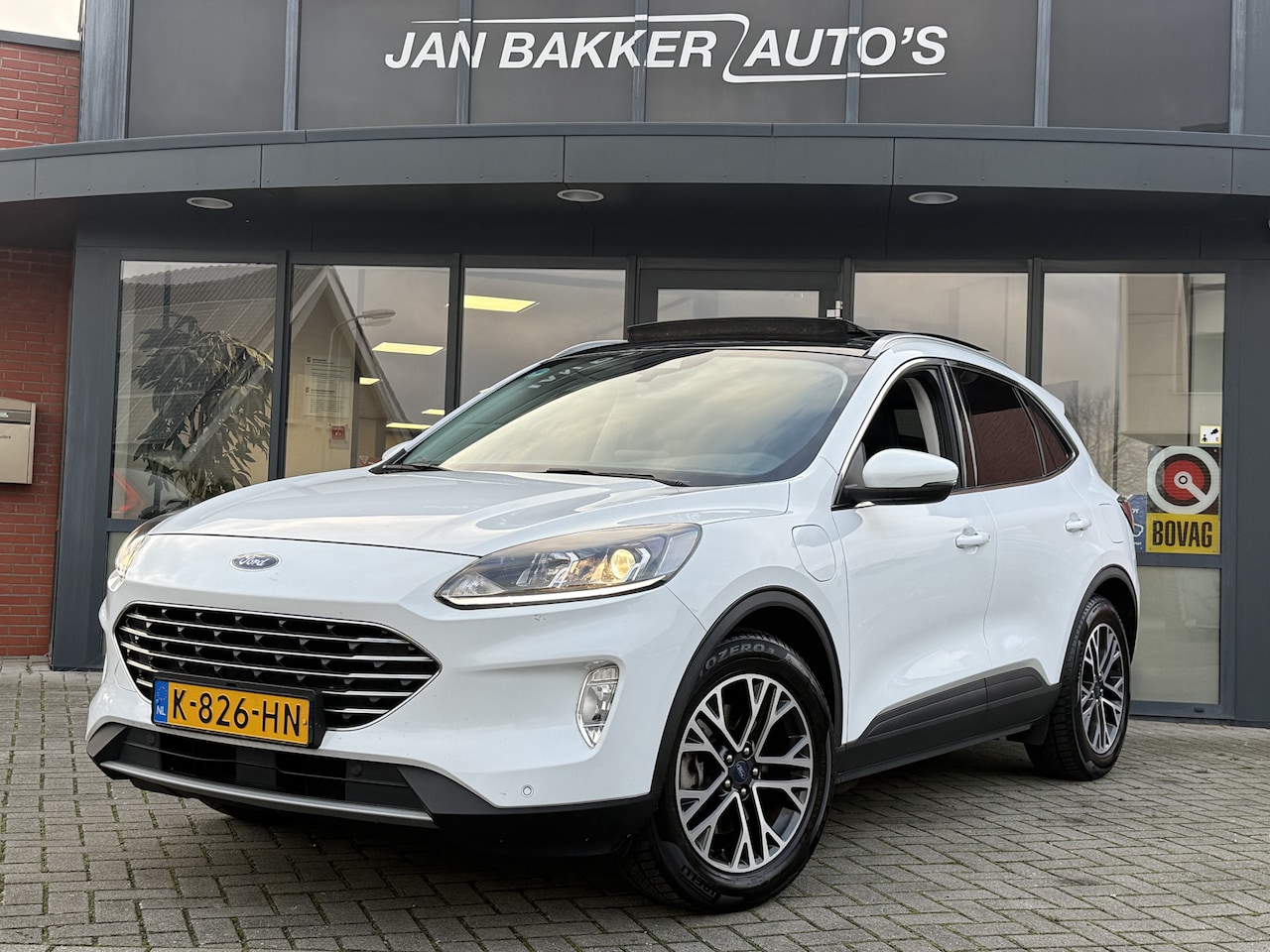 Ford Kuga - 2.5 PHEV Titanium ✅ Panoramadak ✅ Carplay  ✅ TREKHAAK - AutoWereld.nl