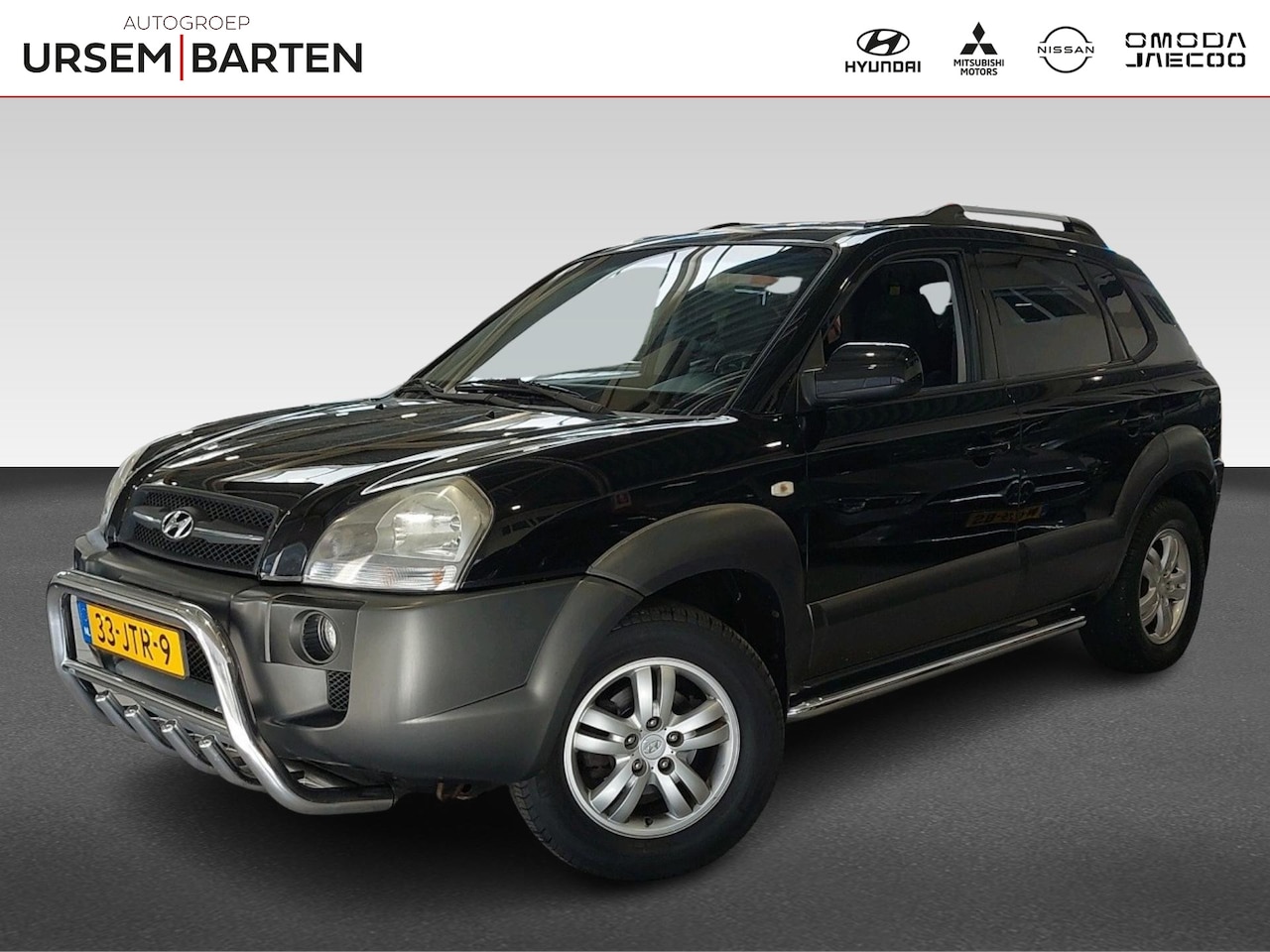 Hyundai Tucson - 2.0i Style Cross | Airco | Cruise control | Kleur zwart - AutoWereld.nl