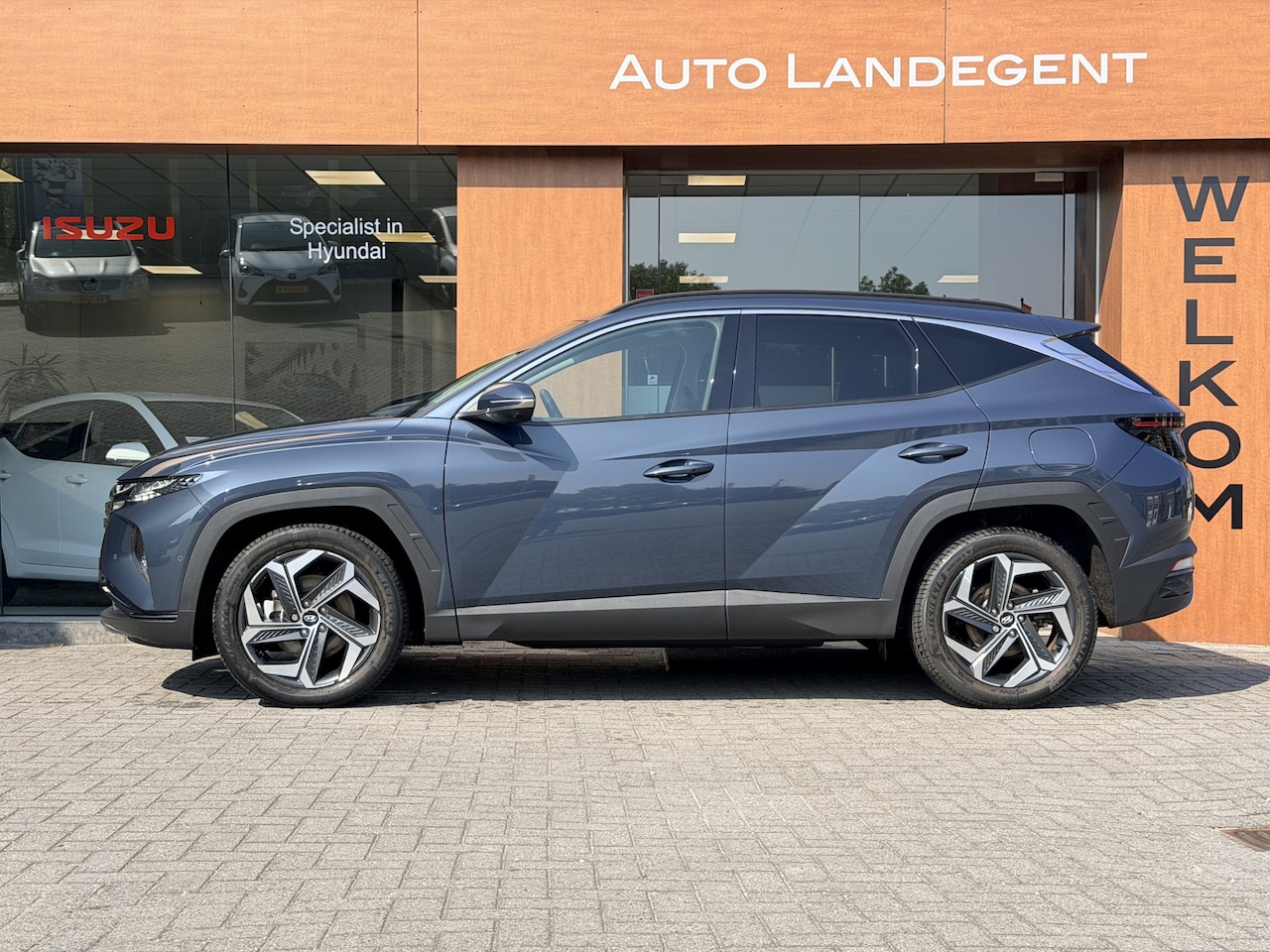Hyundai Tucson - 1.6 T-GDI HEV Premium | NAV | DAB | 360 Camera | Trekhaak | Carplay | Adaptieve cruise con - AutoWereld.nl