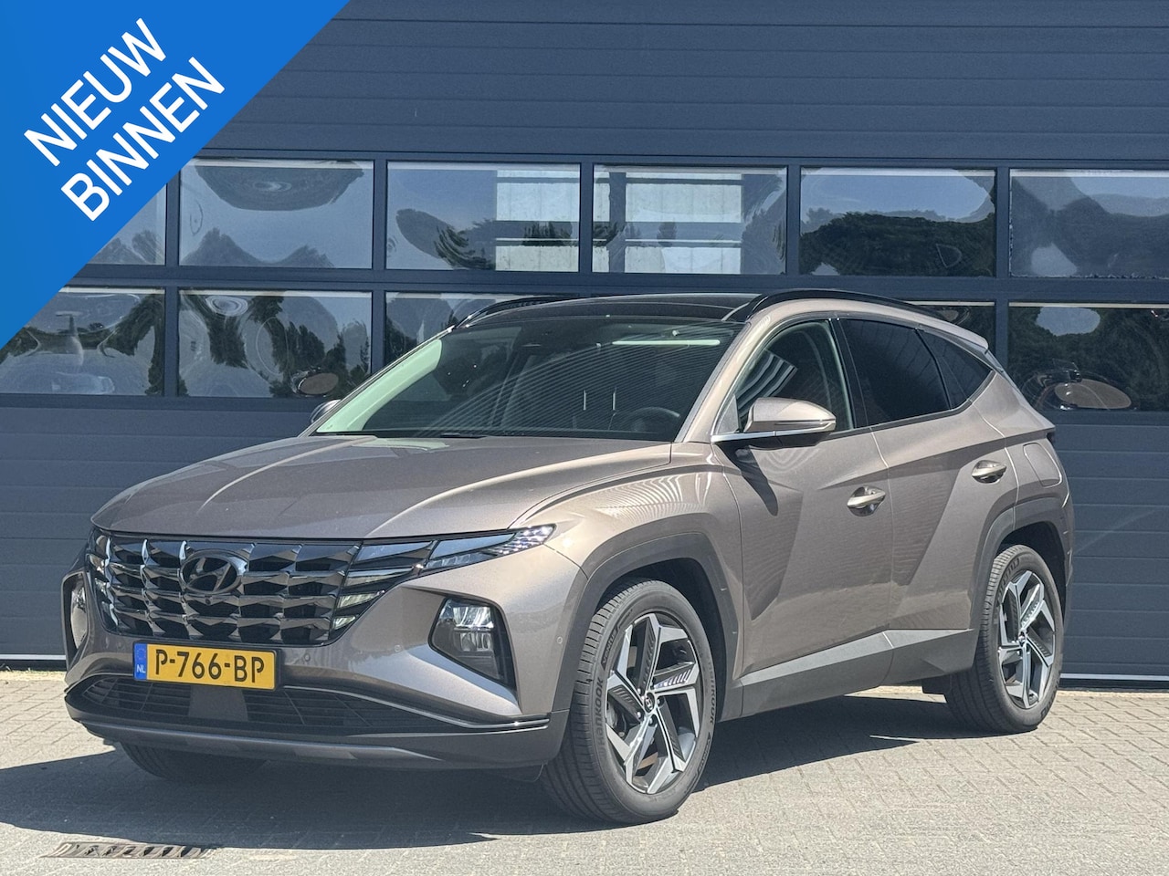 Hyundai Tucson - 1.6 T-GDI HEV PREMIUM SKY I SCHUIF/KANTELDAK I CLIMATE CONTROL I STOELVERWARMING I APPLE C - AutoWereld.nl