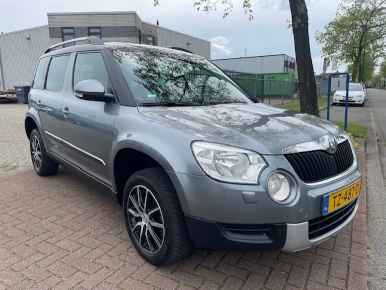 Skoda Yeti - 1.2 TSI Elegance Airco/ECC,Navigatie,Panoramadak - AutoWereld.nl