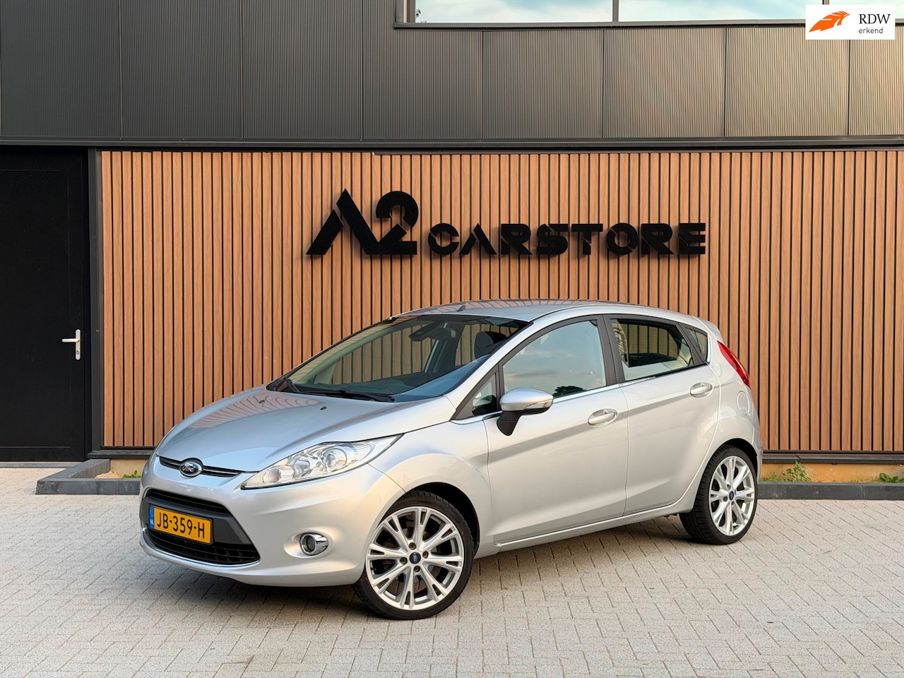 Ford Fiesta - 1.4 Titanium XENON STOELVERWARMING NETTE AUTO - AutoWereld.nl