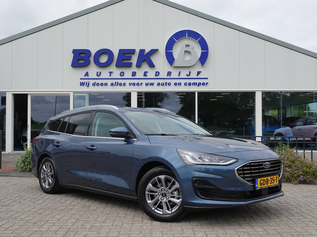 Ford Focus Wagon - 1.0 EcoBoost Hybrid Titanium AUTOM. | PDC V+A | NAVI | CRUISE - AutoWereld.nl