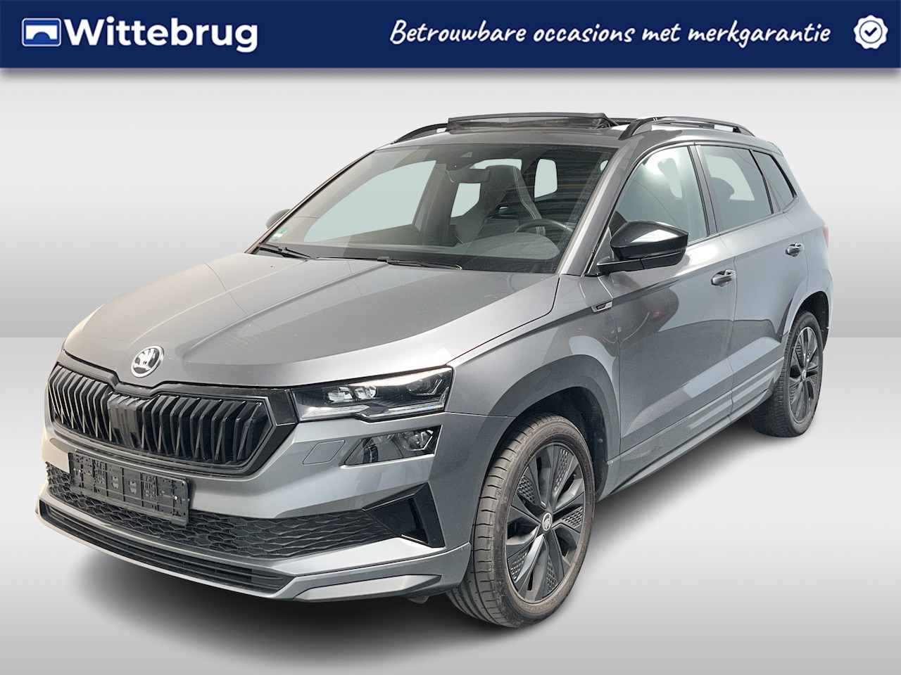 Skoda Karoq - 1.5 TSI ACT Sportline Business / AUTOMAAT/ PANODAK/ DIGITAL DASH/ KEYLESS/ SMARTLINK/ PARK - AutoWereld.nl