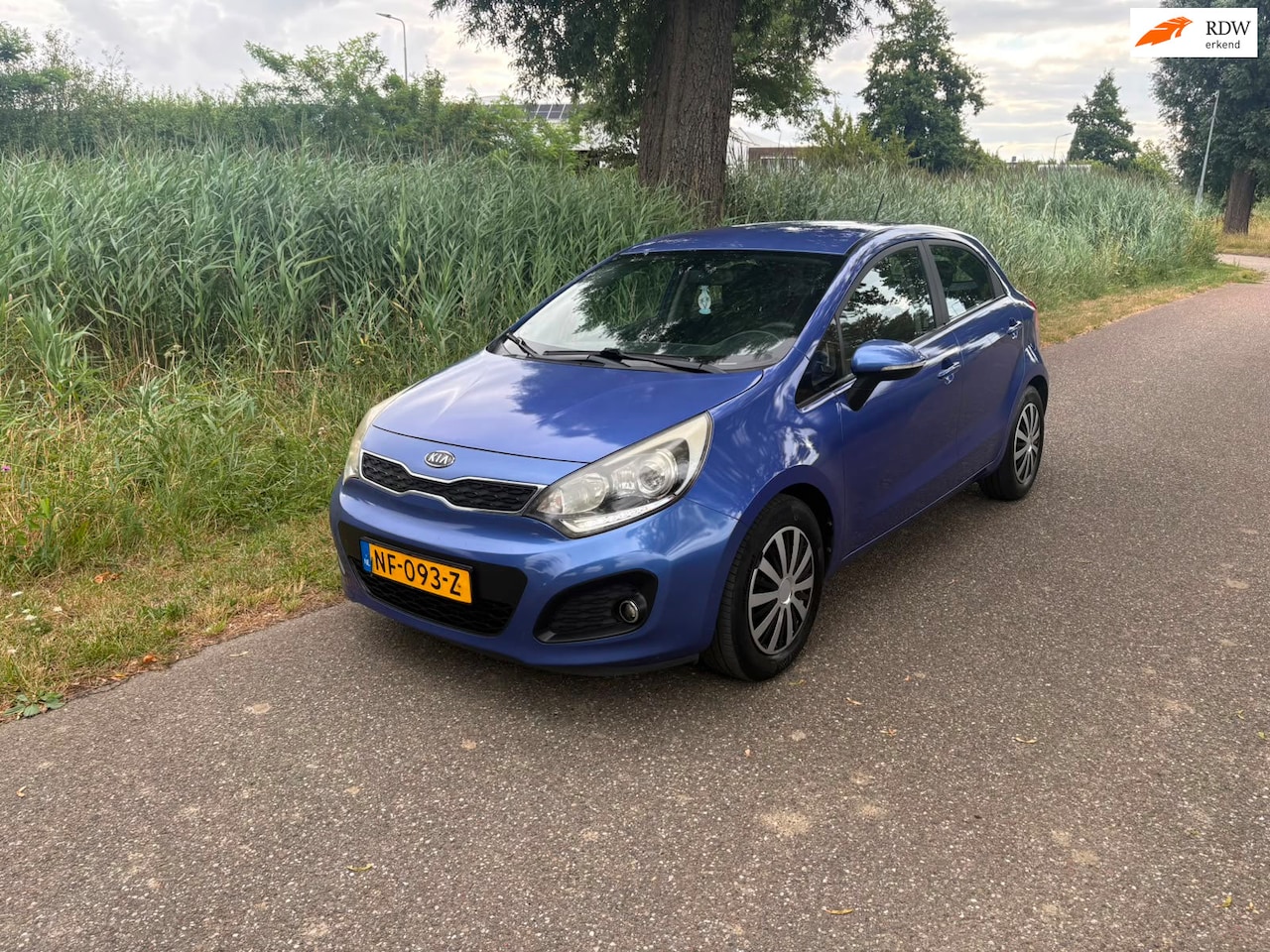 Kia Rio - 1.2 CVVT Plus Pack 1e Eigenaar Airco Cruise Navi - AutoWereld.nl