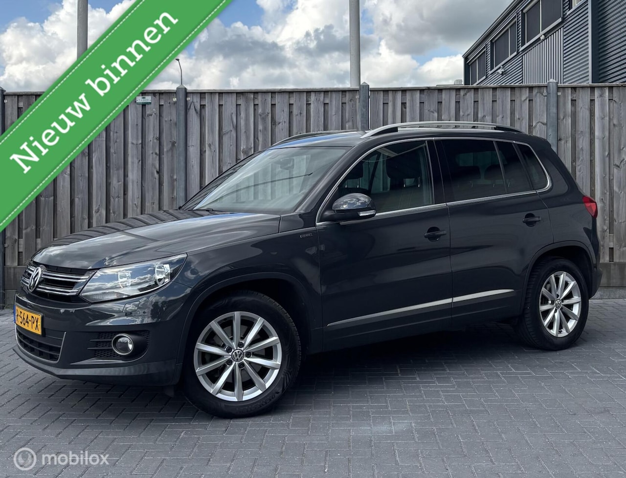 Volkswagen Tiguan - 1.4 TSI Sport&Style/STOELVW/NAVI/PDC/ - AutoWereld.nl