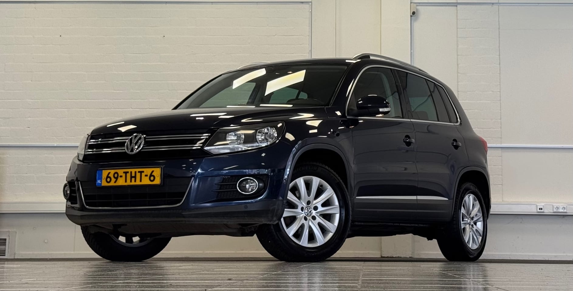 Volkswagen Tiguan - 2.0 TSI Sport&Style 4Motion NL-auto Leer Navi Camera - AutoWereld.nl